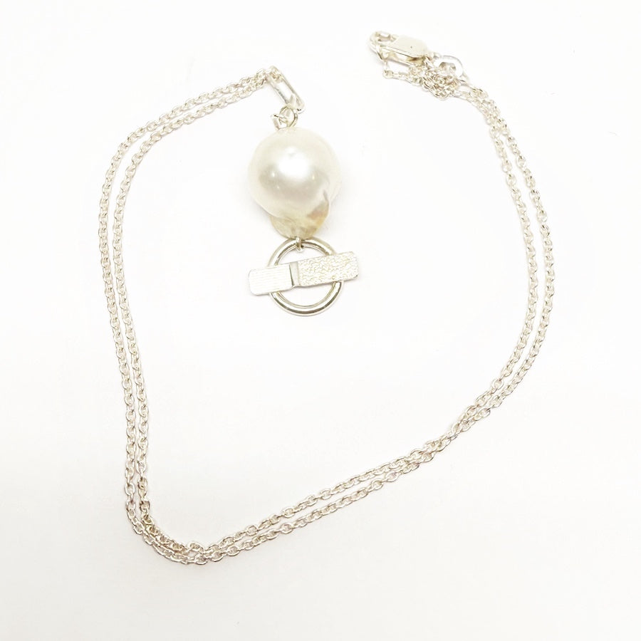 Small Baroque pearl and sterling silver pendant