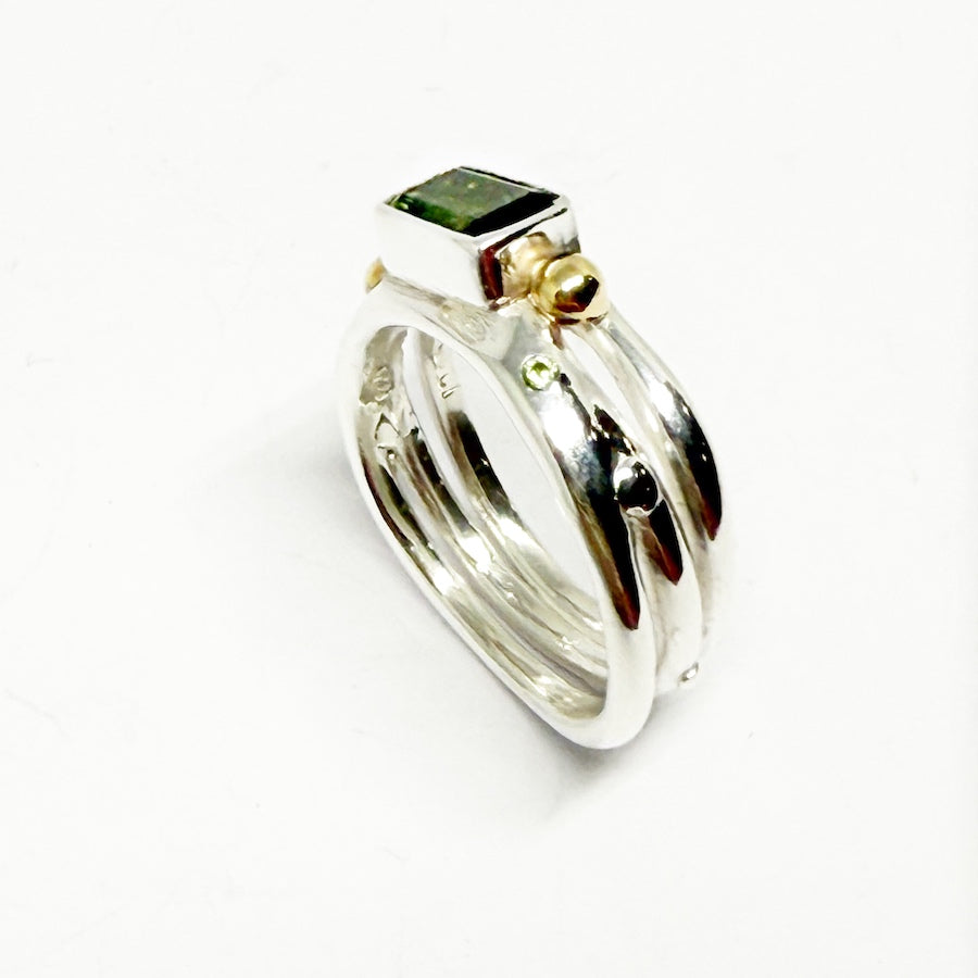 Green tourmaline ring in sterling silver embelished with 9ct gold and green Sapphire