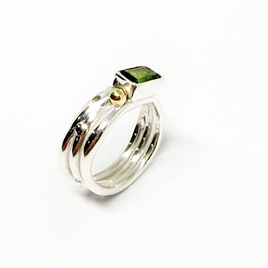 Green tourmaline ring in sterling silver embelished with 9ct gold and green Sapphire