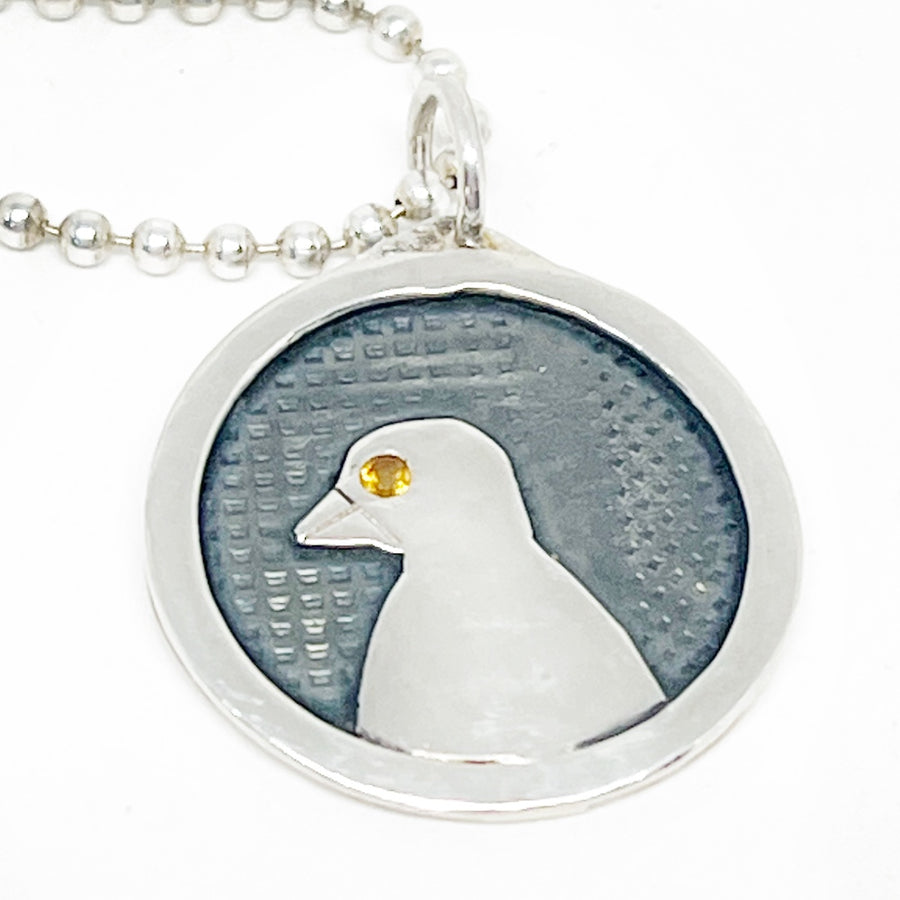 Ethical sterling silver pendant with citrine and a bird