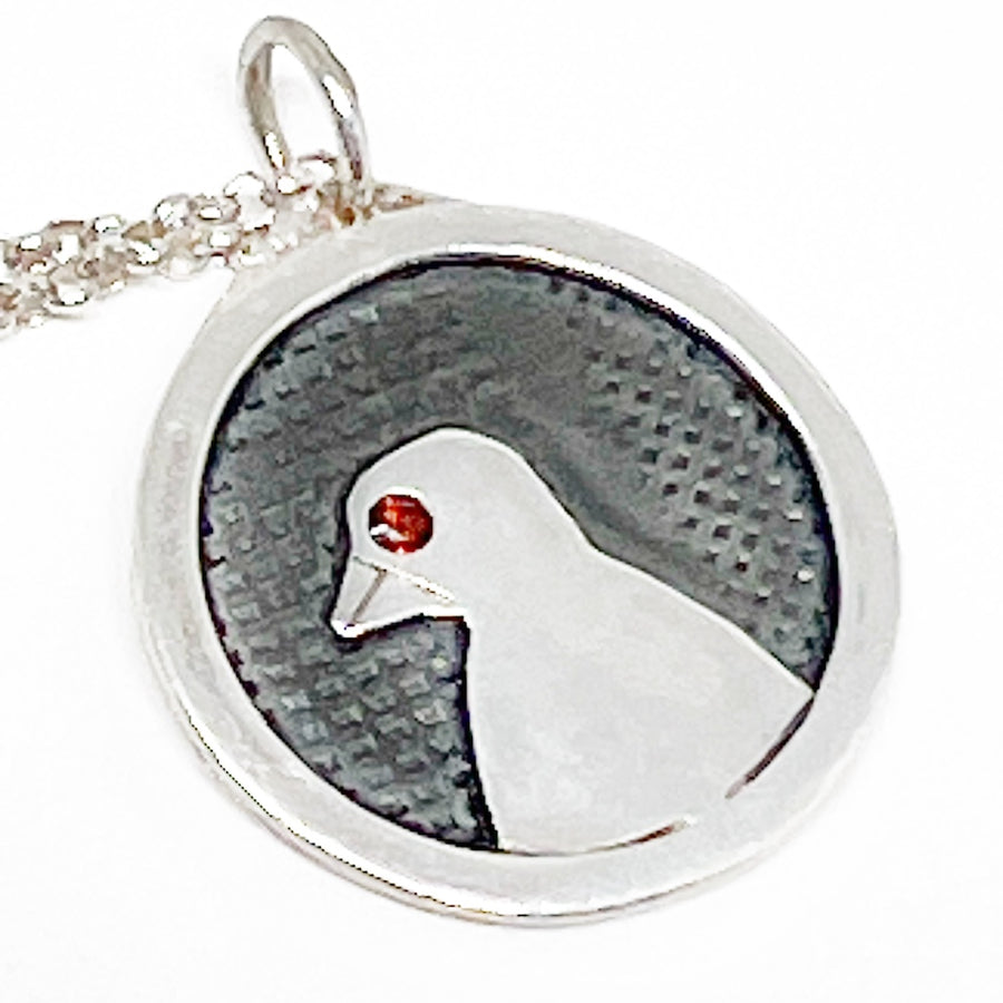 Recycled Sterling silver and garnet pendant with a bird