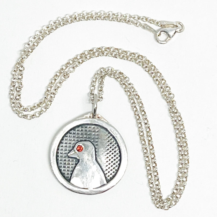 Recycled Sterling silver and garnet pendant with a bird