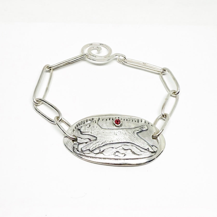 Sterling silver bracelet with dog and ruby