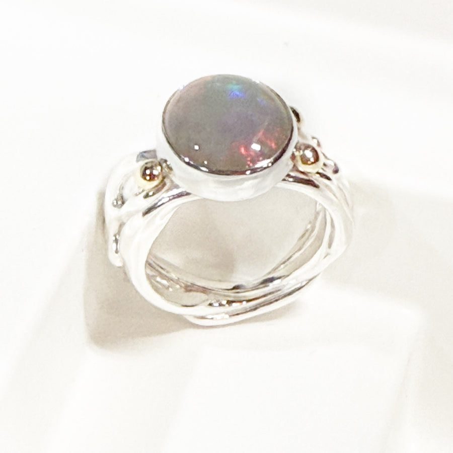 Solid Australian opal in sterling silver, with 9ct gold ring