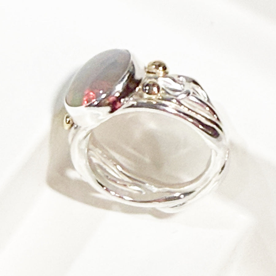 Solid Australian opal in sterling silver, with 9ct gold ring