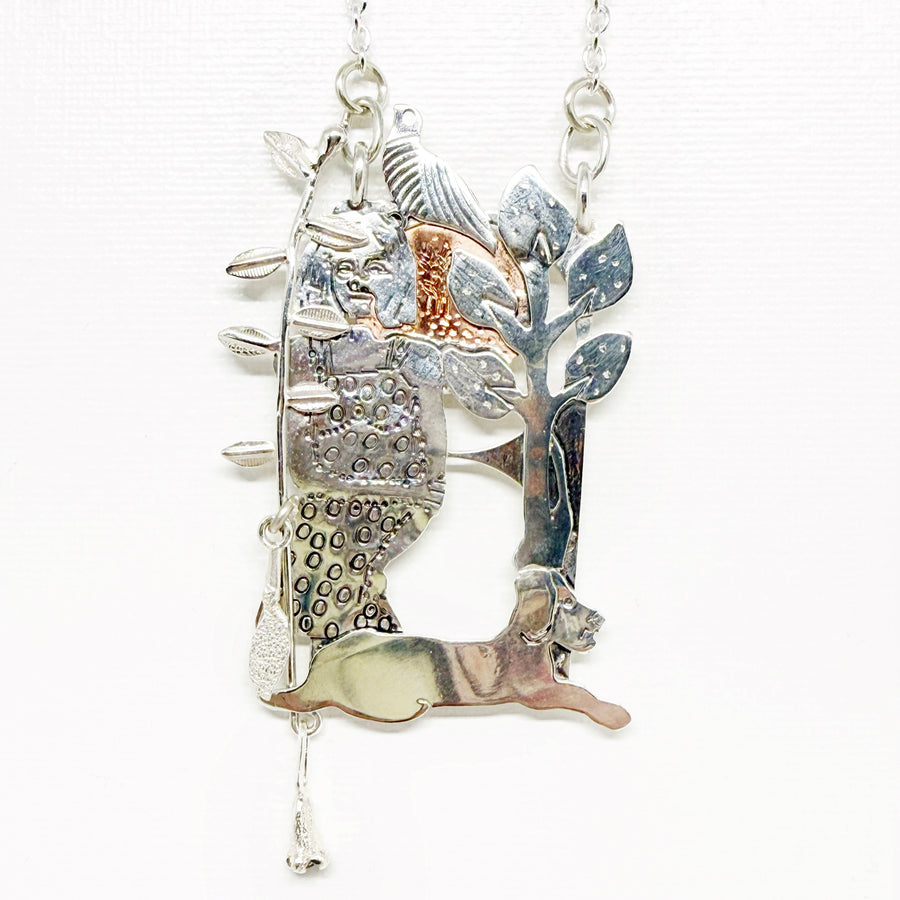 Pendant in sterling silver and copper woman, bird and dog