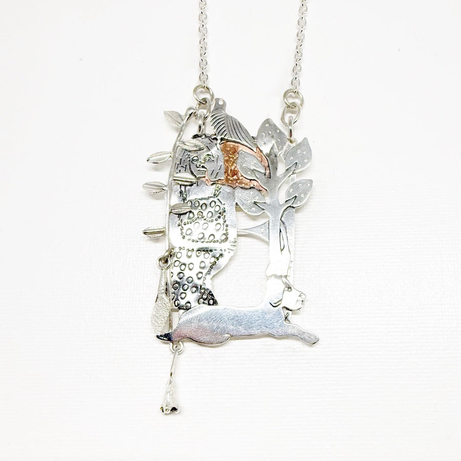 Pendant in sterling silver and copper woman, bird and dog