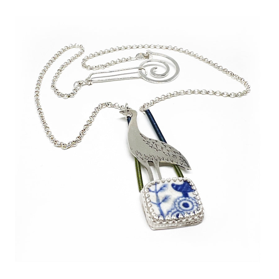 Pendant in Sterling Silver with antique pottery with dk blue enamel coated wire